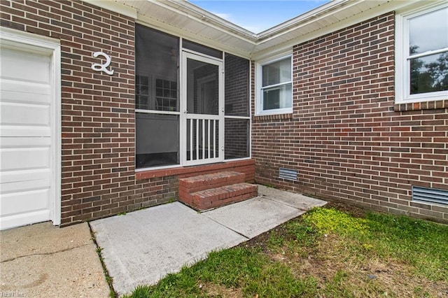 2 Sheralyn Pl, Hampton, VA 23666 - view of patio featuring a sunroom and an attached garage