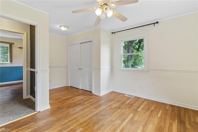 2 Sheralyn Pl, Hampton, VA 23666 - unfurnished bedroom featuring multiple windows, light wood-style floors, baseboards, and crown molding