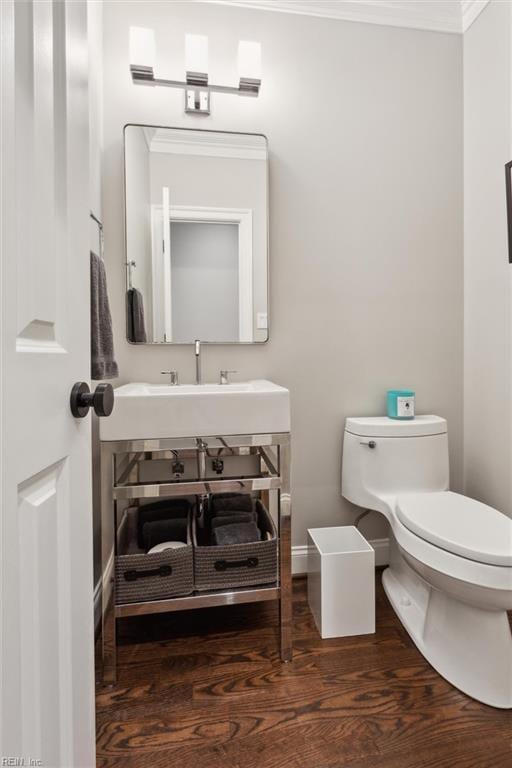 1909 N Fowlers Close Close, Williamsburg, VA 23185 - half bathroom featuring toilet, wood finished floors, baseboards, a sink, and crown molding