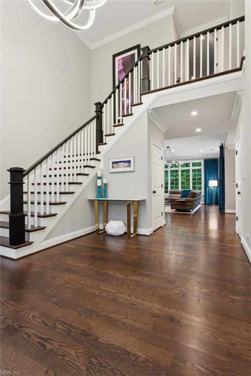 1909 N Fowlers Close Close, Williamsburg, VA 23185 - staircase featuring ornamental molding, wood finished floors, a chandelier, baseboards, and recessed lighting