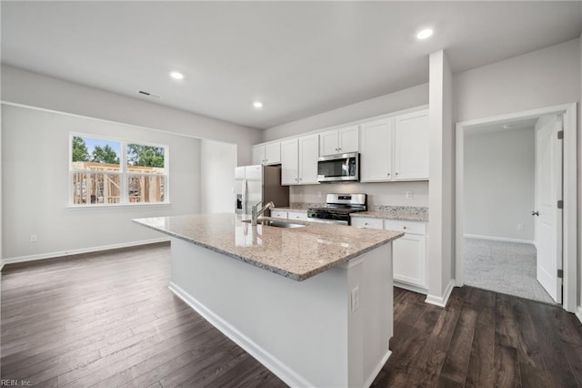 3032 Dalton Cir, Suffolk, VA 23435 - kitchen featuring stainless steel appliances, an island with sink, white cabinetry, a sink, and recessed lighting