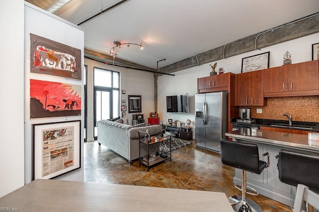 415 Saint Pauls Blvd Unit 309, Norfolk, VA 23510 - kitchen with stainless steel refrigerator with ice dispenser, a sink, concrete flooring, and tasteful backsplash