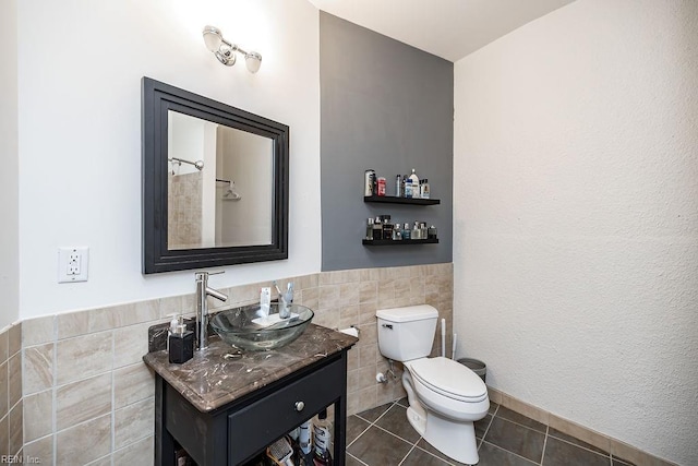 415 Saint Pauls Blvd Unit 309, Norfolk, VA 23510 - full bath featuring tile walls, toilet, vanity, tile patterned floors, and a wainscoted wall