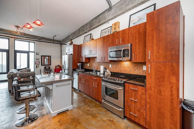 415 Saint Pauls Blvd Unit 309, Norfolk, VA 23510 - kitchen with appliances with stainless steel finishes, a sink, finished concrete flooring, backsplash, and a kitchen bar