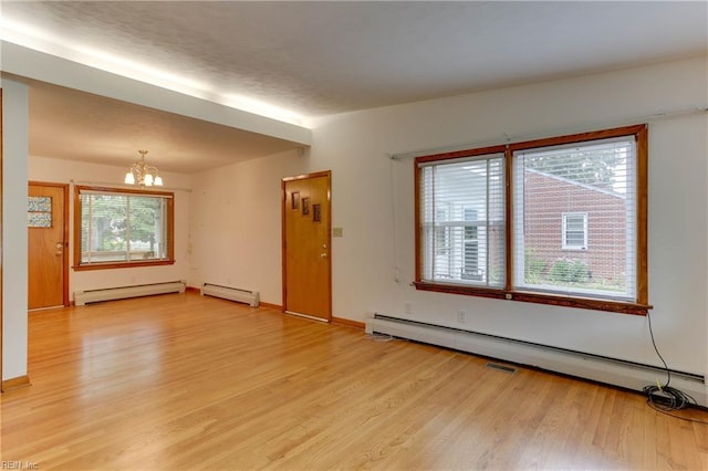 449 Martha Lee Dr, Hampton, VA 23666 - unfurnished living room featuring a chandelier, a baseboard radiator, and light wood-type flooring
