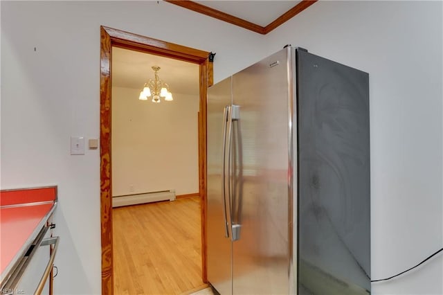 449 Martha Lee Dr, Hampton, VA 23666 - kitchen with a baseboard radiator, freestanding refrigerator, crown molding, light wood finished floors, and a chandelier