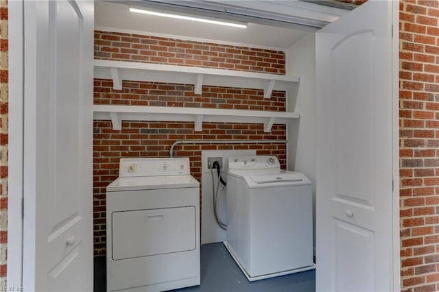 449 Martha Lee Dr, Hampton, VA 23666 - laundry area with washer and clothes dryer and brick wall