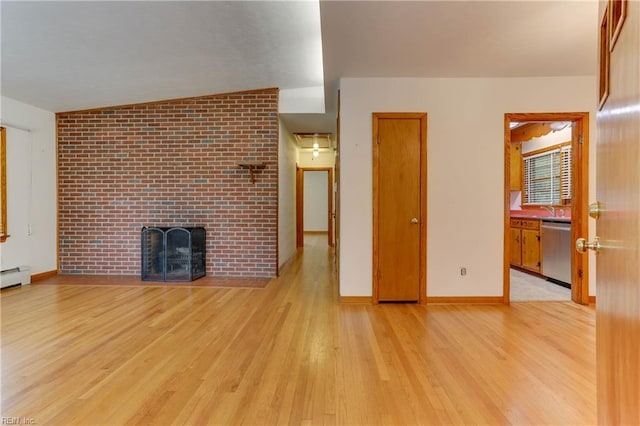 449 Martha Lee Dr, Hampton, VA 23666 - unfurnished living room featuring wood finished floors, a brick fireplace, baseboards, and a sink