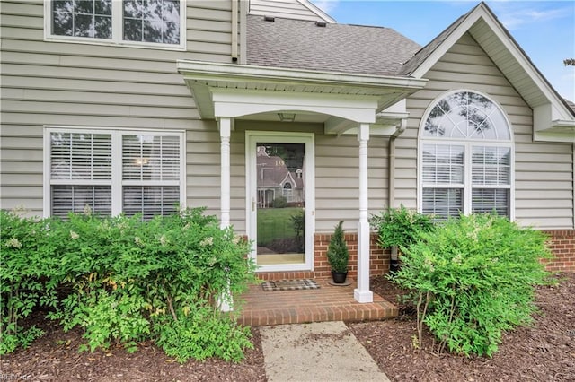 189 Shoal Crk, Williamsburg, VA 23185 - property entrance featuring a shingled roof and brick siding