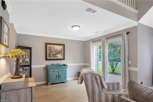 189 Shoal Crk, Williamsburg, VA 23185 - dining room with light wood-style floors, crown molding, and baseboards