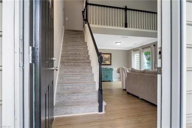 189 Shoal Crk, Williamsburg, VA 23185 - staircase featuring wood finished floors and crown molding