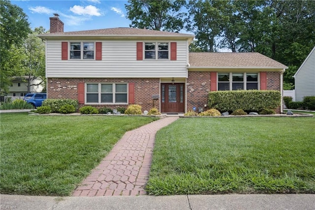 1 Hatteras Lndg, Hampton, VA 23669 - split level home with a chimney, a front lawn, and brick siding