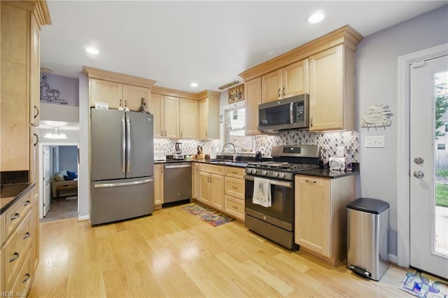 1 Hatteras Lndg, Hampton, VA 23669 - kitchen with stainless steel appliances, light brown cabinets, dark countertops, tasteful backsplash, and recessed lighting