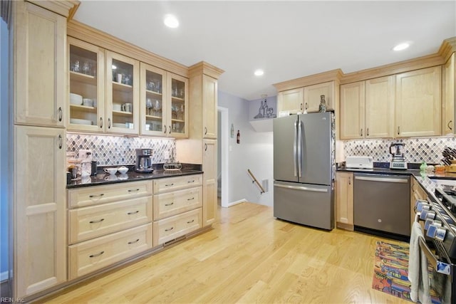 1 Hatteras Lndg, Hampton, VA 23669 - kitchen featuring stainless steel appliances, light brown cabinetry, decorative backsplash, light wood finished floors, and recessed lighting