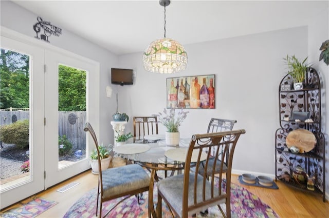 1 Hatteras Lndg, Hampton, VA 23669 - dining space with wood finished floors and a chandelier