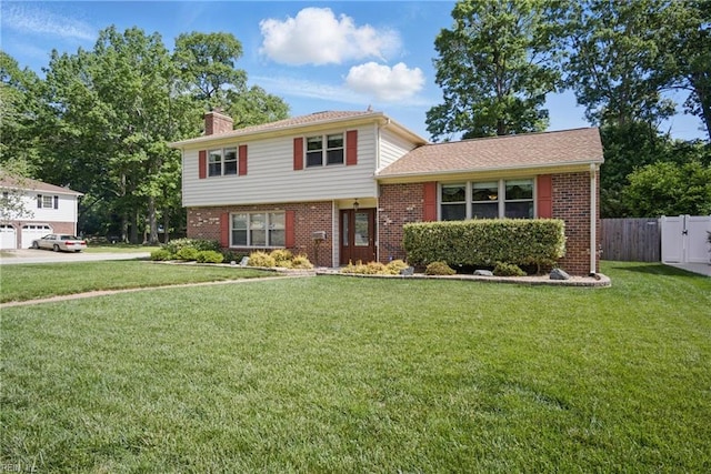 1 Hatteras Lndg, Hampton, VA 23669 - tri-level home featuring brick siding and a chimney