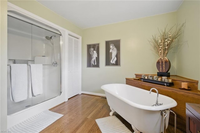 1 Hatteras Lndg, Hampton, VA 23669 - full bath featuring baseboards, wood finished floors, a shower stall, and a freestanding tub