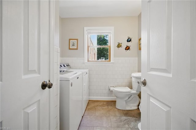 1 Hatteras Lndg, Hampton, VA 23669 - half bath with toilet, washing machine and clothes dryer, tile walls, wainscoting, and tile patterned floors
