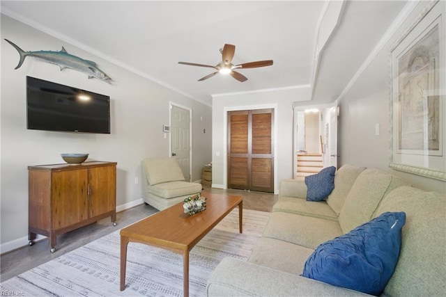 1 Hatteras Lndg, Hampton, VA 23669 - living room featuring a ceiling fan, baseboards, stairway, and ornamental molding