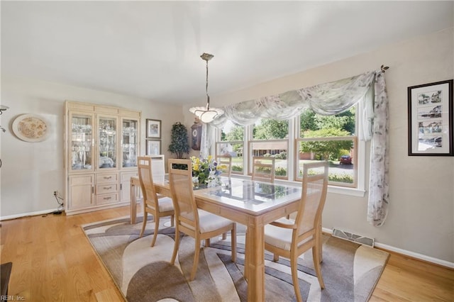 1 Hatteras Lndg, Hampton, VA 23669 - dining room featuring light wood-style floors and baseboards