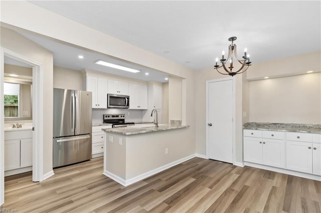 5352 Bardith Cir, Virginia Beach, VA 23455 - kitchen with appliances with stainless steel finishes, light wood-style flooring, white cabinetry, a chandelier, and recessed lighting