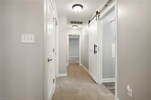 1120 Veranda Way, Chesapeake, VA 23320 - hallway with a barn door, light carpet, and baseboards