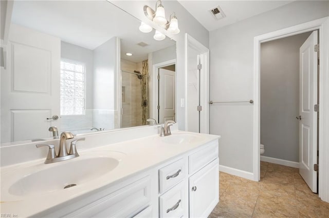 1120 Veranda Way, Chesapeake, VA 23320 - bathroom with double vanity, toilet, a tile shower, and baseboards