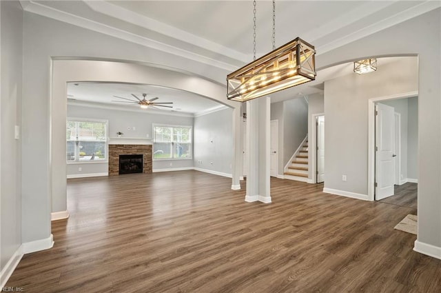 1120 Veranda Way, Chesapeake, VA 23320 - unfurnished living room featuring a ceiling fan, stairway, dark wood-style floors, baseboards, and a stone fireplace