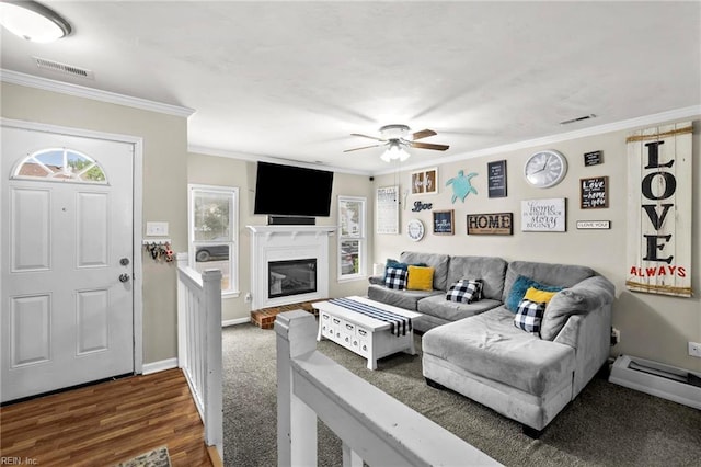 4632 Marlwood Way, Virginia Beach, VA 23462 - living area with ceiling fan, crown molding, baseboards, a baseboard radiator, and a glass covered fireplace