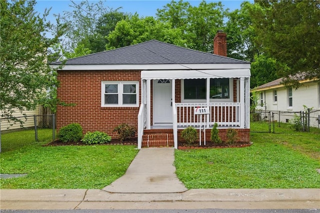 111 S Lloyd St, Suffolk, VA 23434 - bungalow with a porch, a chimney, a shingled roof, and brick siding