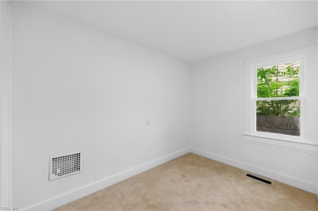 111 S Lloyd St, Suffolk, VA 23434 - spare room featuring light colored carpet, baseboards, and crown molding