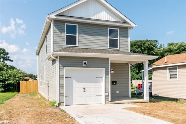 208 Beech St, Suffolk, VA 23434 - view of front facade featuring an attached garage, driveway, and board and batten siding