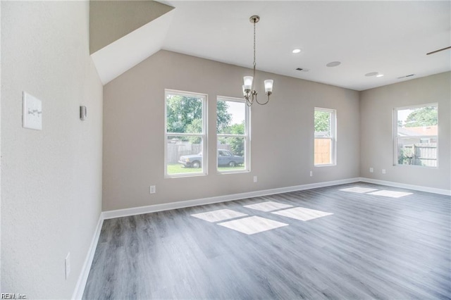 208 Beech St, Suffolk, VA 23434 - spare room featuring wood finished floors, a chandelier, baseboards, vaulted ceiling, and recessed lighting