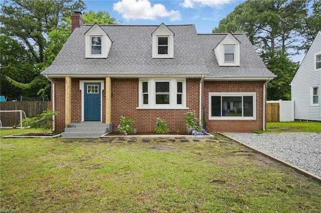 8715 Semmes Ave, Norfolk, VA 23503 - cape cod-style house with brick siding, a chimney, and a shingled roof