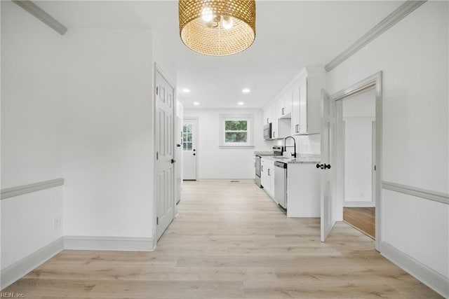 8715 Semmes Ave, Norfolk, VA 23503 - hall with a chandelier, light wood-style flooring, recessed lighting, a sink, and baseboards