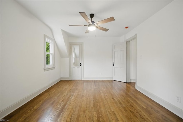 8715 Semmes Ave, Norfolk, VA 23503 - unfurnished room with wood finished floors, a ceiling fan, and baseboards