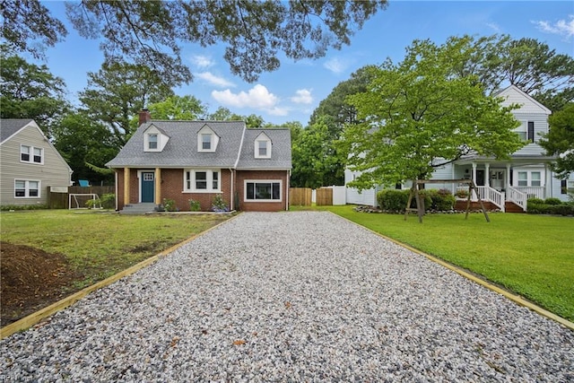 8715 Semmes Ave, Norfolk, VA 23503 - cape cod house with brick siding, gravel driveway, and a chimney