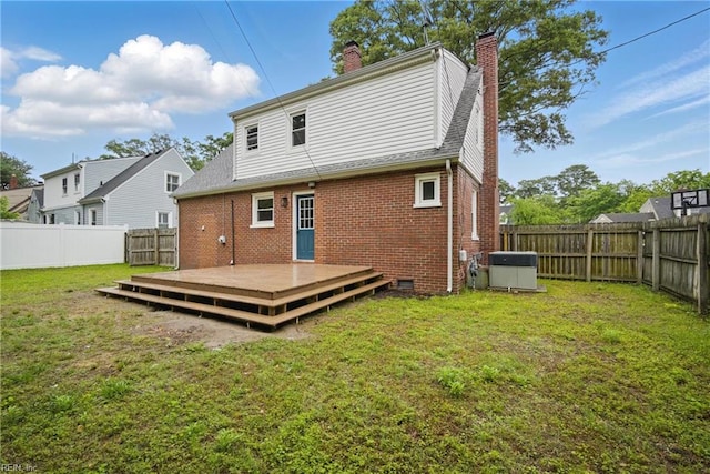 8715 Semmes Ave, Norfolk, VA 23503 - back of house featuring a chimney, a deck, brick siding, and central AC unit