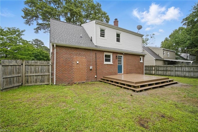 8715 Semmes Ave, Norfolk, VA 23503 - rear view of house with a wooden deck, brick siding, a chimney, and a shingled roof