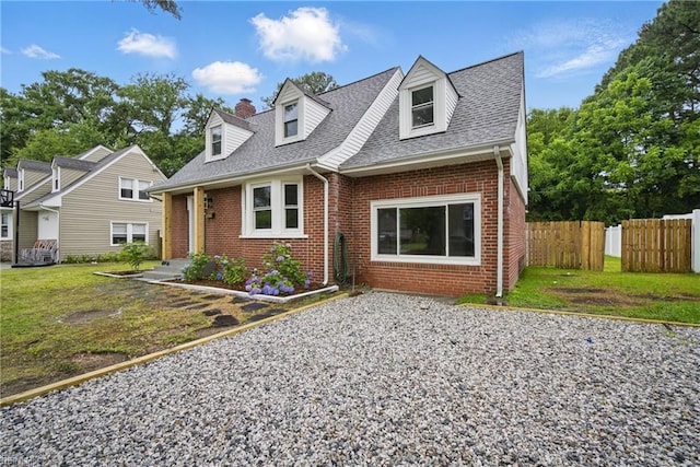 8715 Semmes Ave, Norfolk, VA 23503 - cape cod-style house featuring brick siding, a shingled roof, and a chimney