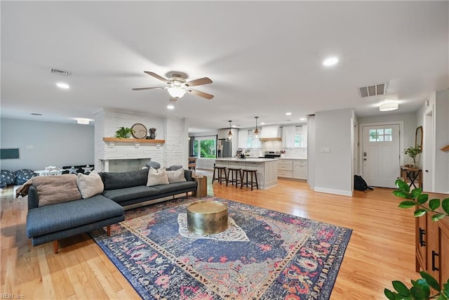 4629 Hermitage Rd, Virginia Beach, VA 23455 - living room featuring light wood finished floors, plenty of natural light, ceiling fan, recessed lighting, and a large fireplace
