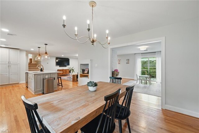 4629 Hermitage Rd, Virginia Beach, VA 23455 - dining room with light wood-style floors, a chandelier, baseboards, and recessed lighting