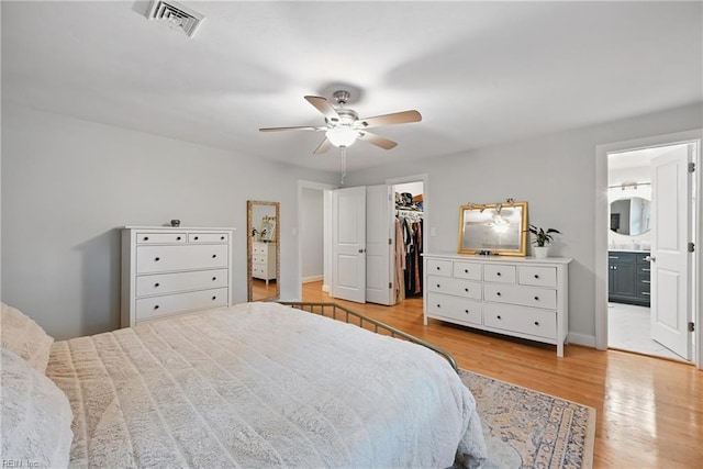 4629 Hermitage Rd, Virginia Beach, VA 23455 - bedroom with a walk in closet, light wood finished floors, a closet, connected bathroom, and ceiling fan