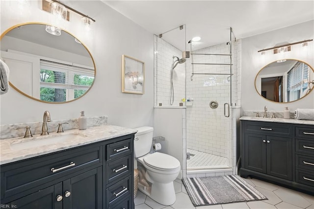 4629 Hermitage Rd, Virginia Beach, VA 23455 - bathroom with two vanities, tile patterned floors, a shower stall, and toilet