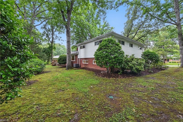 4629 Hermitage Rd, Virginia Beach, VA 23455 - view of grassy yard featuring central AC unit