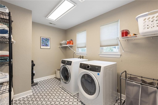 1025 Sullivan Ln, Chesapeake, VA 23322 - laundry area with washer and dryer, tile patterned floors, and baseboards
