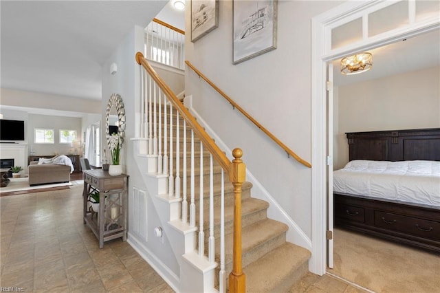 1025 Sullivan Ln, Chesapeake, VA 23322 - stairs featuring baseboards and a fireplace