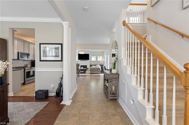 1025 Sullivan Ln, Chesapeake, VA 23322 - entrance foyer with ornate columns, stairs, and baseboards