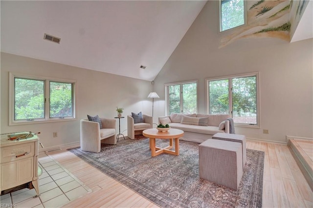 110 Olde Pond Ln, Yorktown, VA 23693 - living area featuring high vaulted ceiling, light wood-type flooring, and baseboards