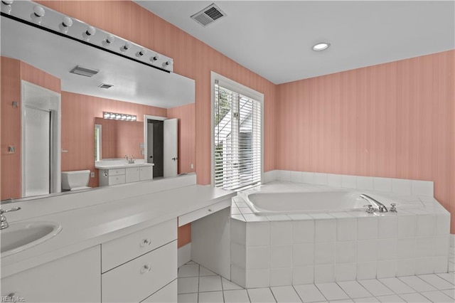 400 Discovery Rd, Virginia Beach, VA 23451 - bathroom with toilet, a bath, vanity, a stall shower, and tile patterned flooring